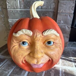 Whimsical Orange Pumpkin Face Sculpture